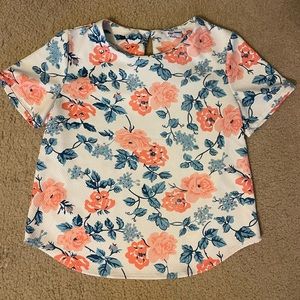 White blouse with blue and orange floral design